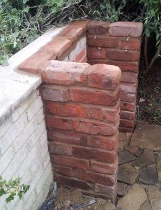 Bricks cut down to make coping stones for the back
